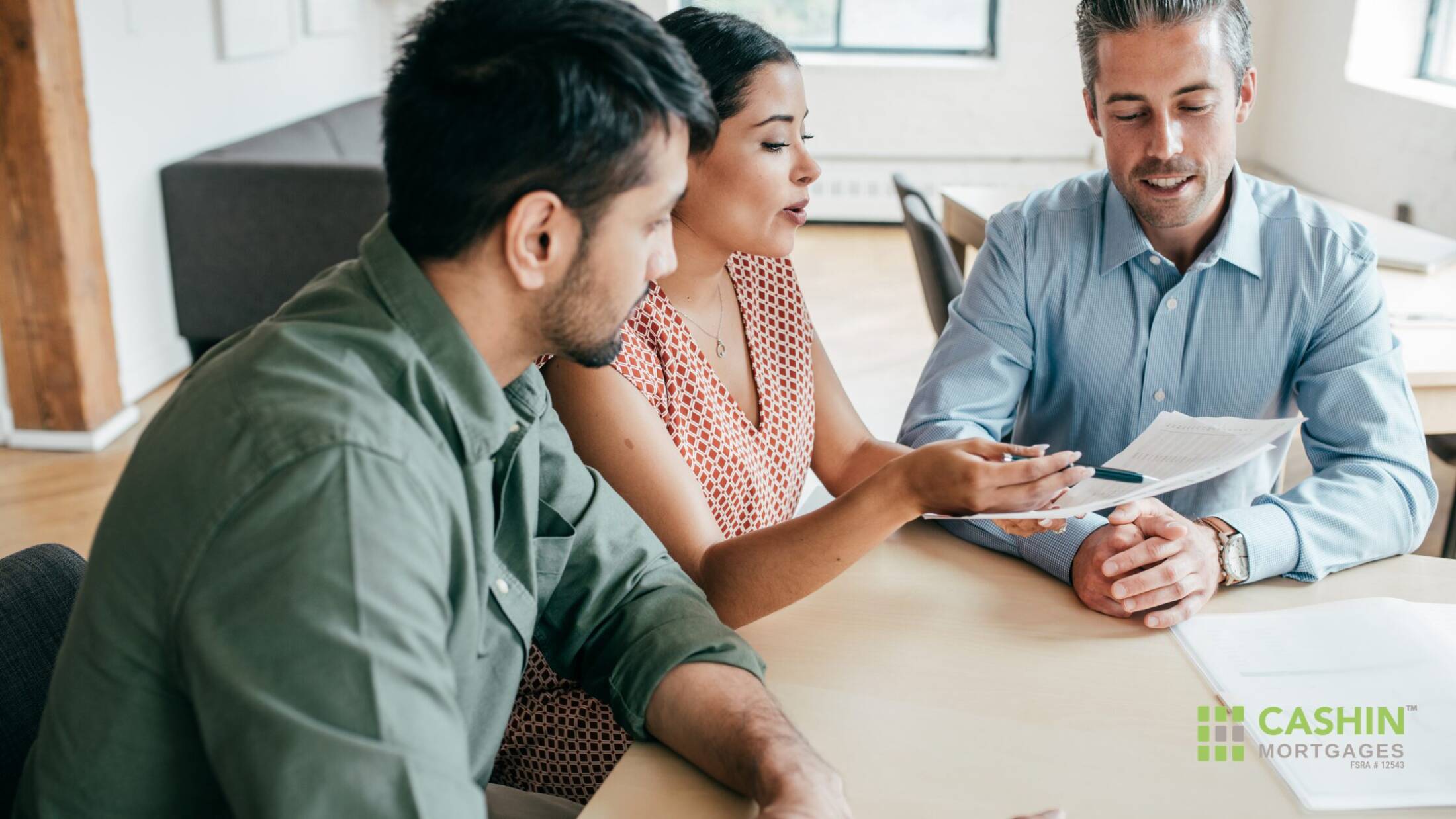 Couple meeting with a mortgage advisor to review home financing documents